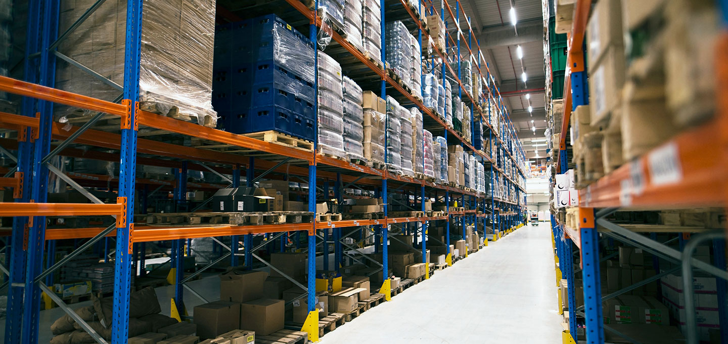 Aisle in the warehouse with high shelves