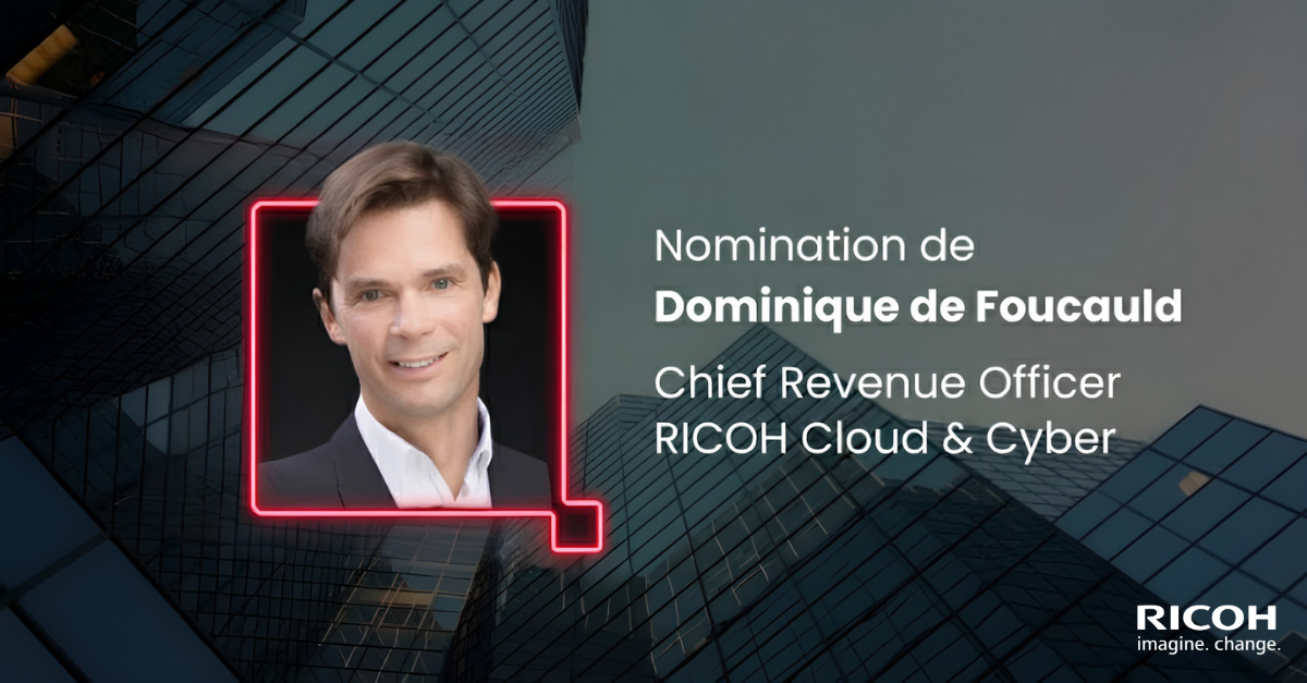 Professional portrait of a middle-aged man wearing a dark blazer and white shirt, smiling confidently against a black background, conveying a polished and approachable corporate image.