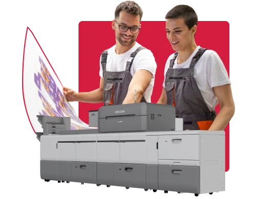 Two persons working with a printer